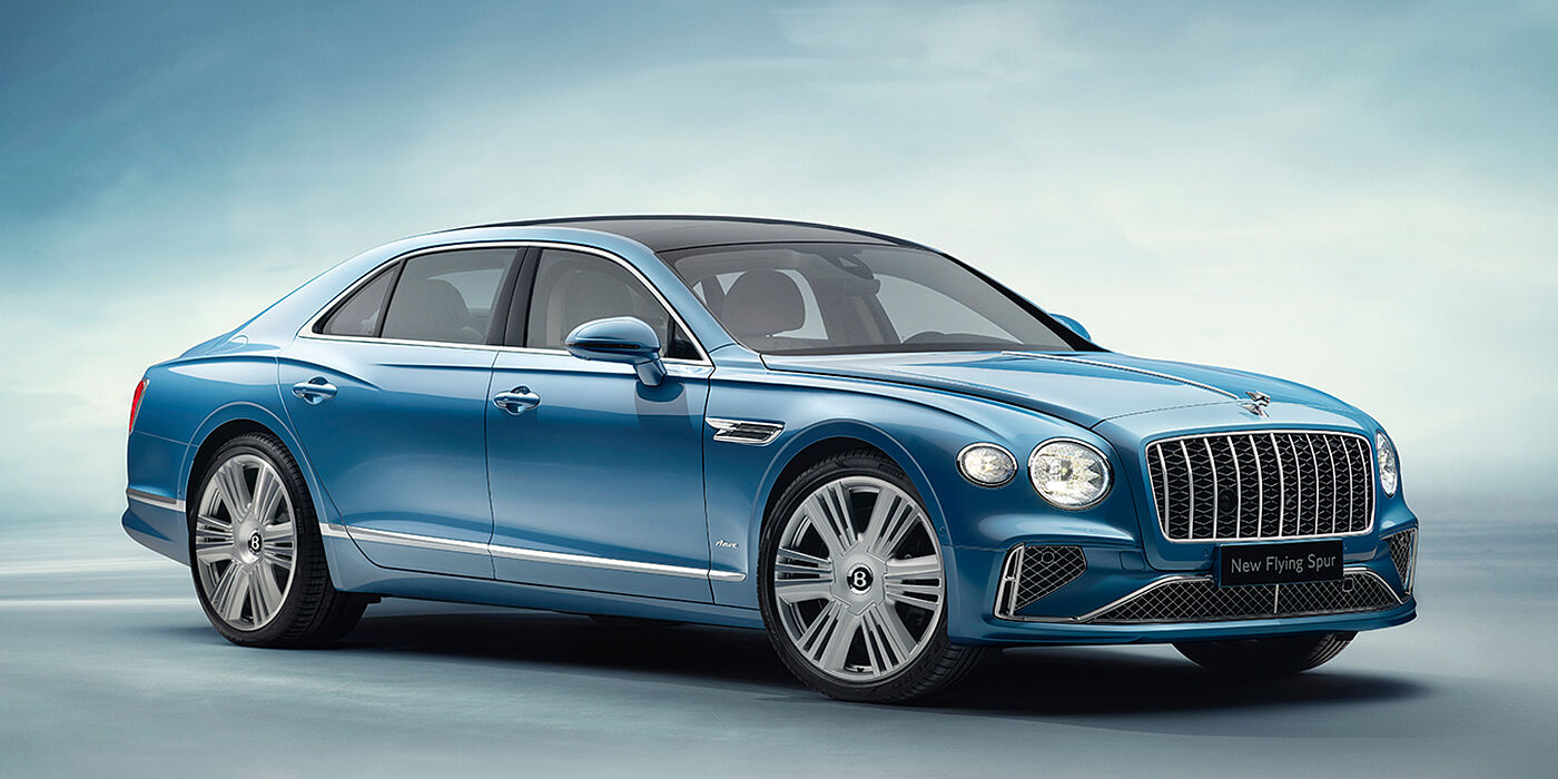 Bentley Budapest New Bentley Flying Spur Azure sedan front view in Light windsor blue by Mulliner paint with 22 inch Azure wheels and chrome exterior details